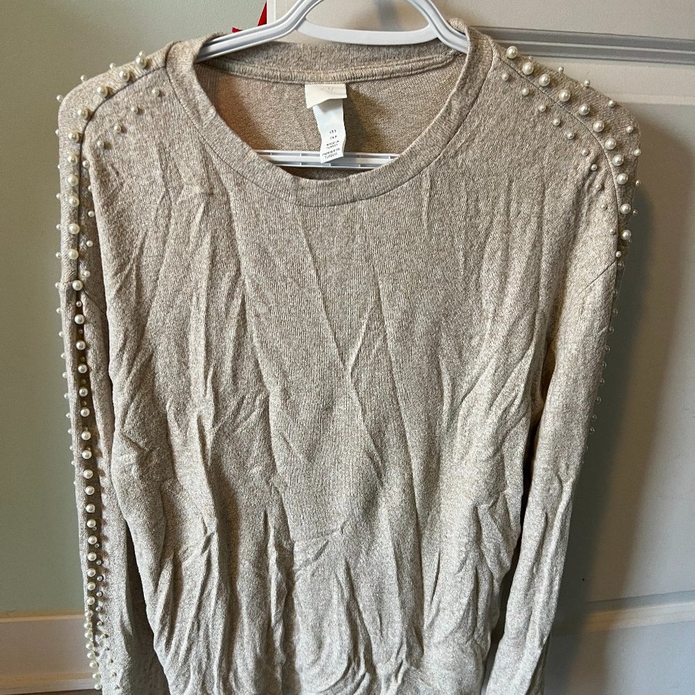 Cream top with pearl embellishments